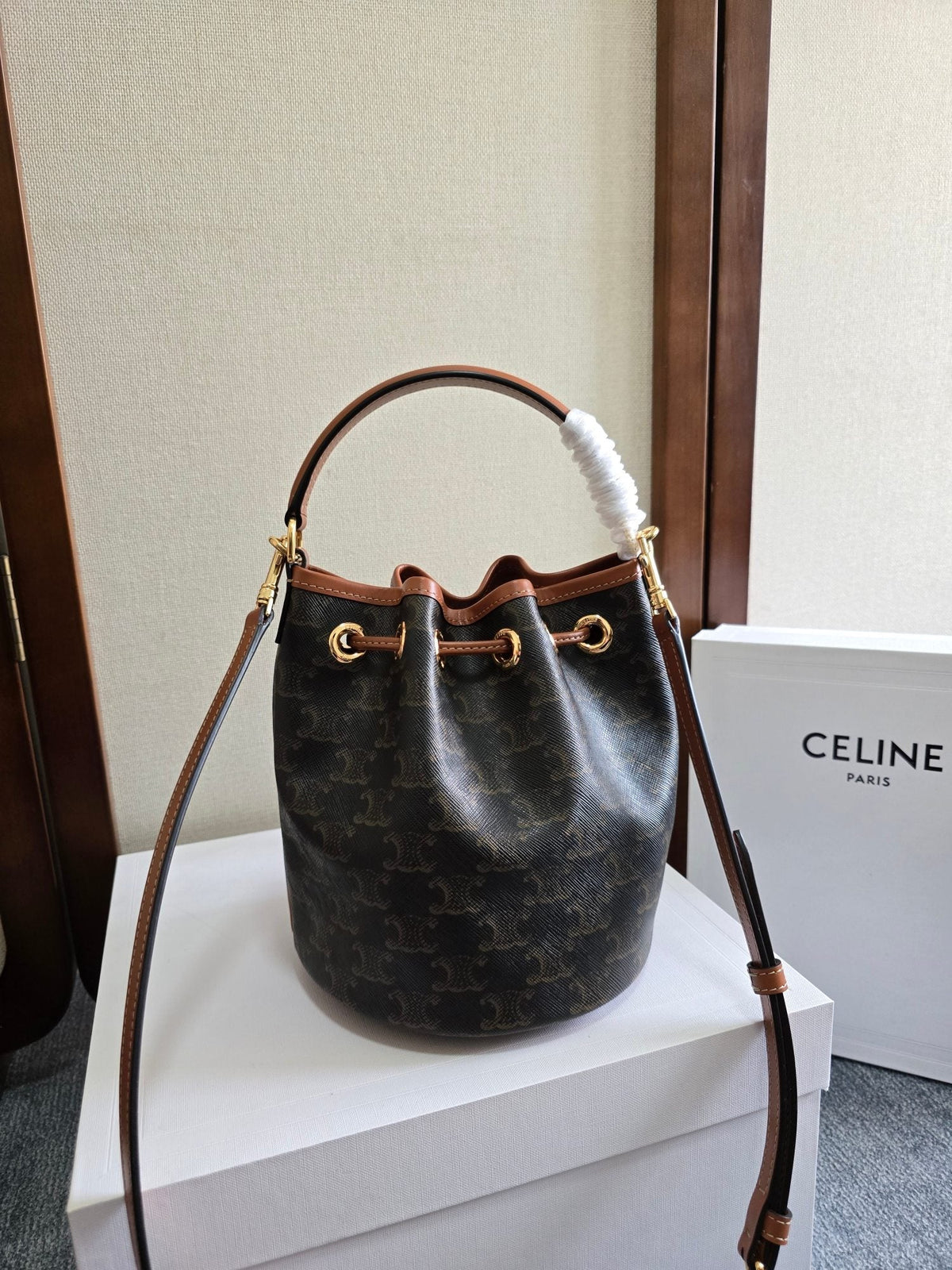 CLARA BAG 19 IN BLACK TRIOMPHE CANVAS AND BROWN CALFSKIN TRIM
